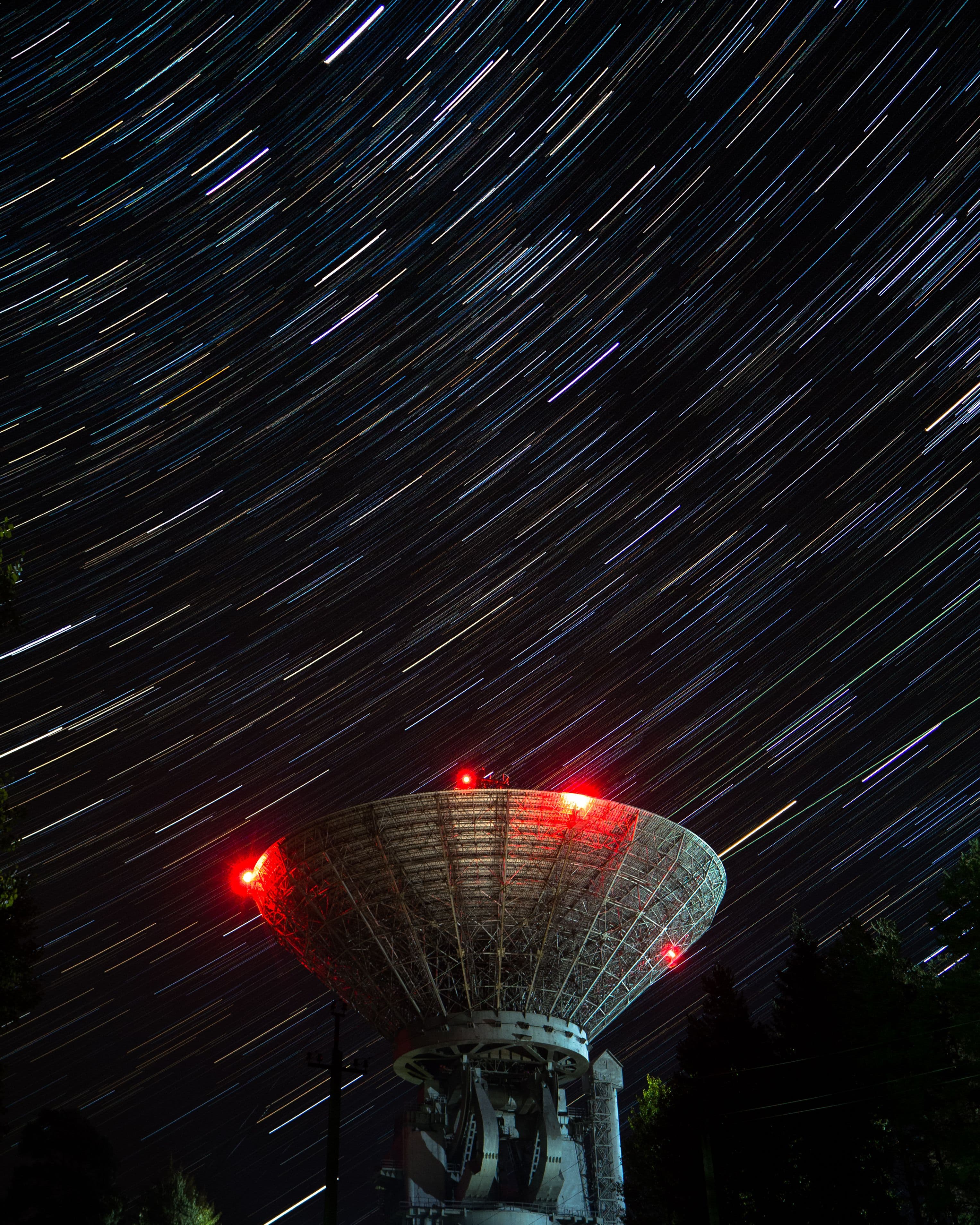 Radio telescope under star trails